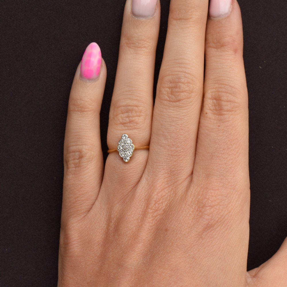 An antique diamond navette cluster ring set in platinum with an 18ct yellow gold band. View VII