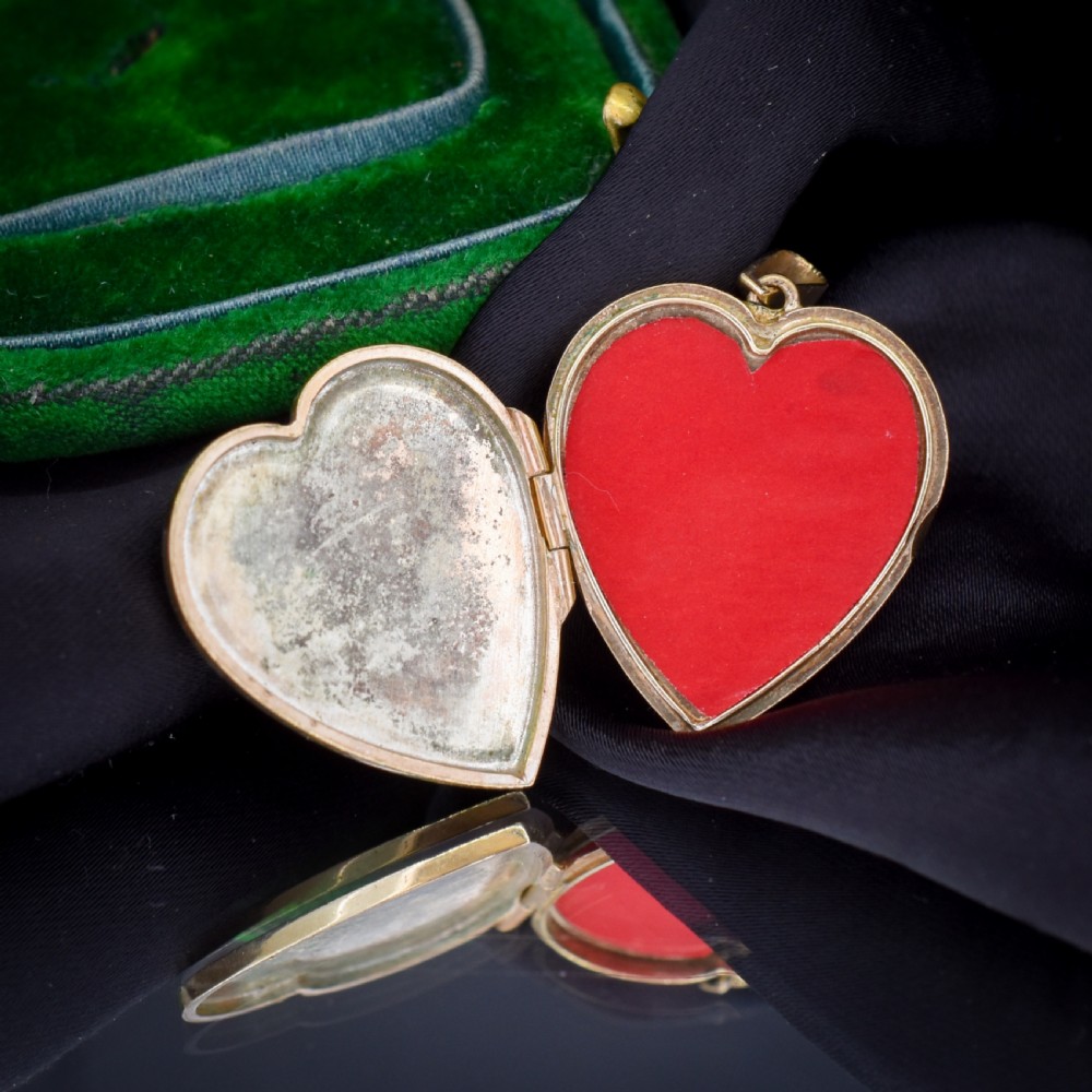A heart-shaped sterling silver pendant paved with hand-cut clear glass paste stones featuring an ornate bail. View XVIII