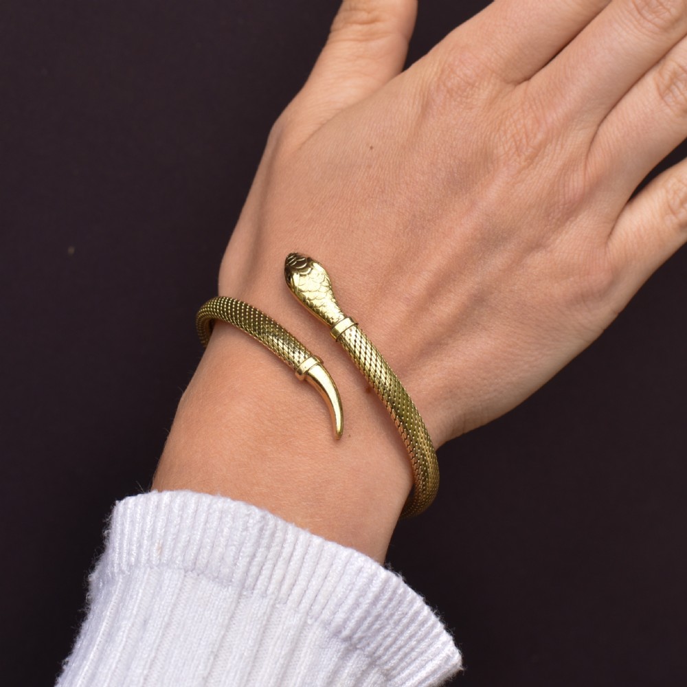 A rolled gold coiled snake bangle bracelet featuring detailed scale engraving, a sculpted head, and a tapered tail. View XI