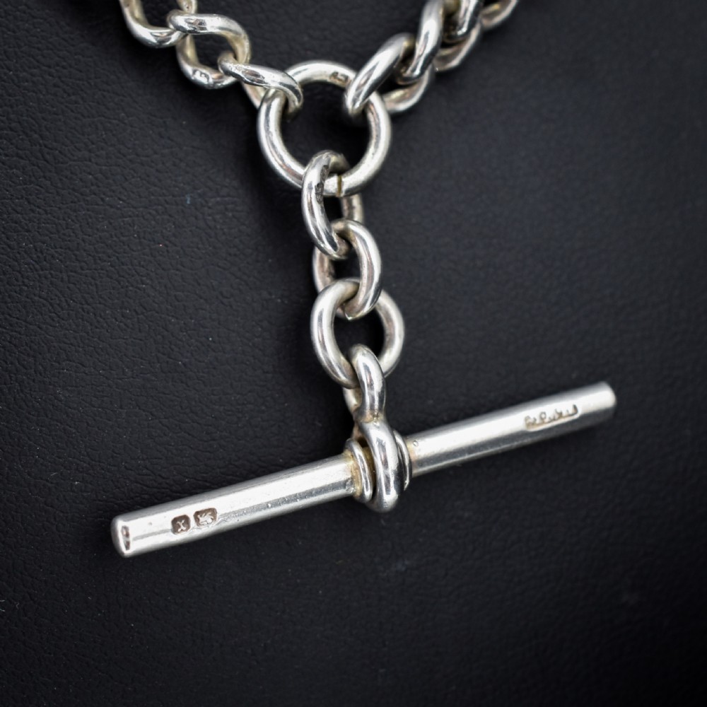 An antique sterling silver curb link watch chain featuring a classic T-bar pendant. View III