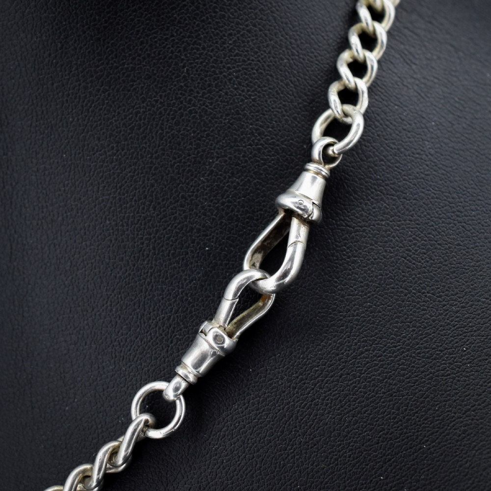 An antique sterling silver curb link watch chain featuring a classic T-bar pendant. View V