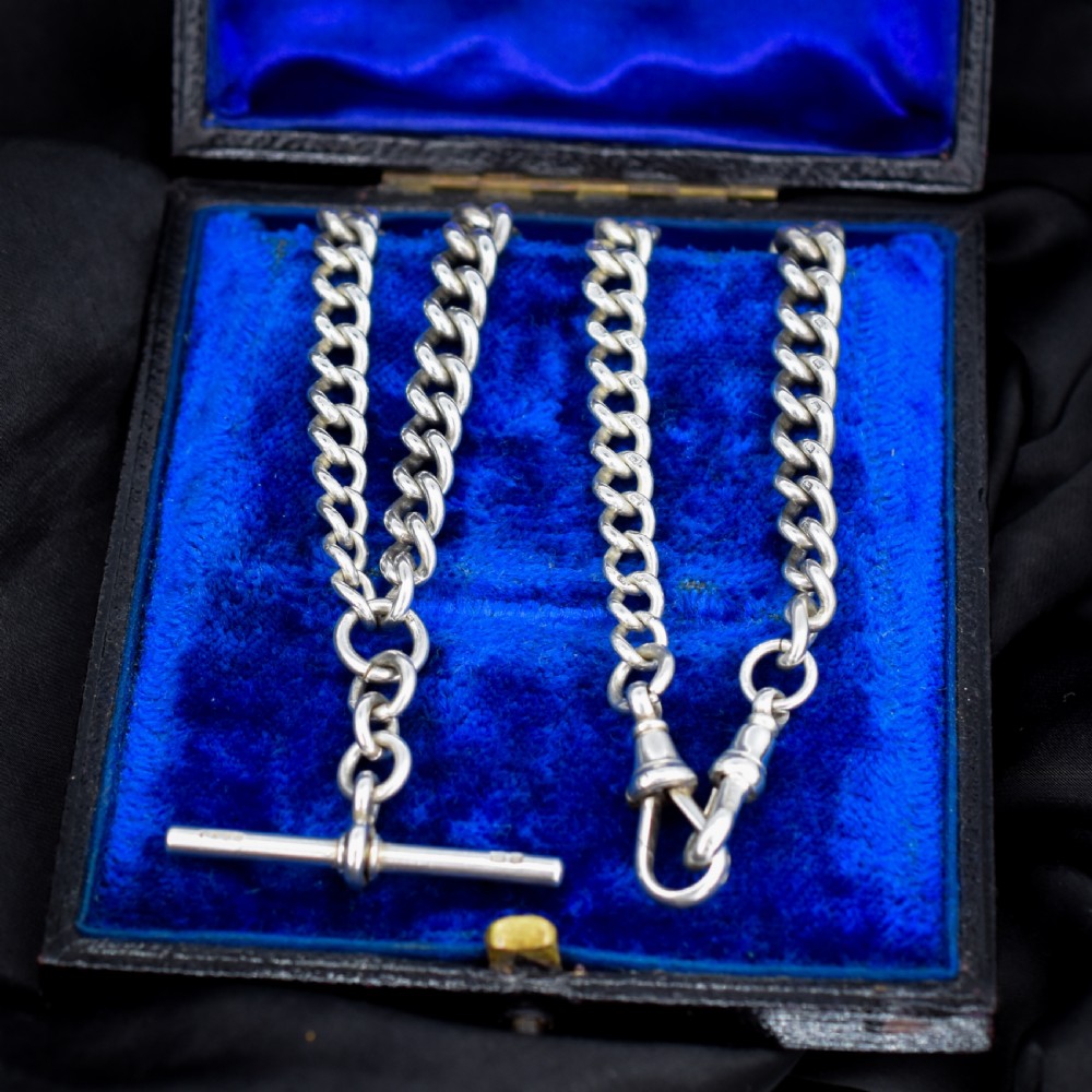 An antique sterling silver curb link watch chain featuring a classic T-bar pendant. View VI