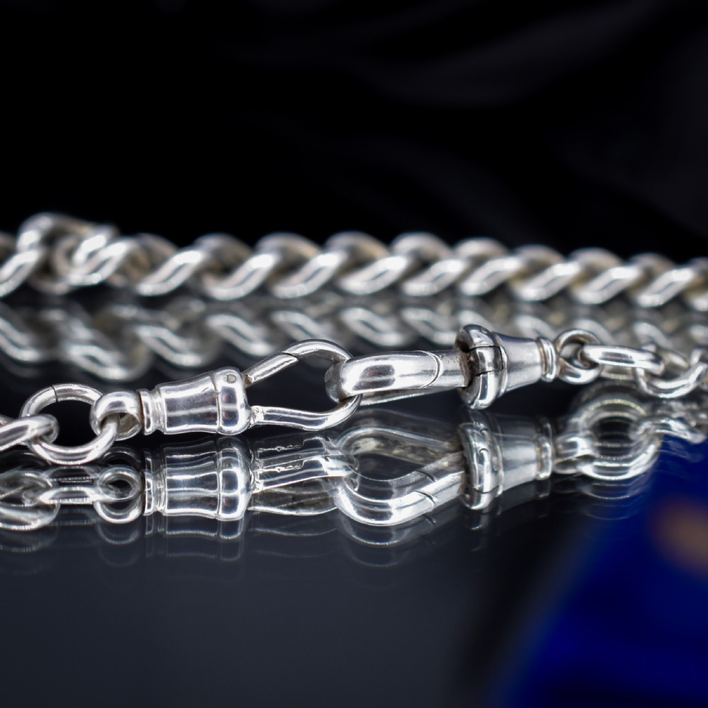 An antique sterling silver curb link watch chain featuring a classic T-bar pendant. View VII