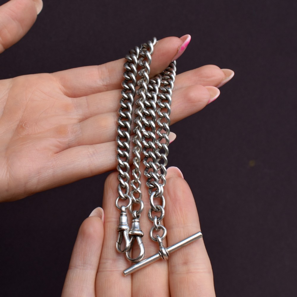 An antique sterling silver curb link watch chain featuring a classic T-bar pendant. View VIII