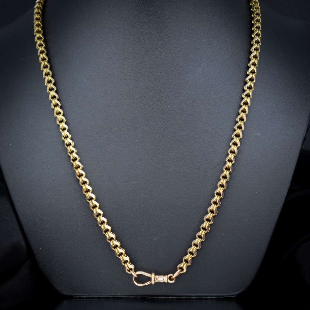 A Victorian 15ct yellow gold fancy link chain necklace fitted with a dog clip fastener.