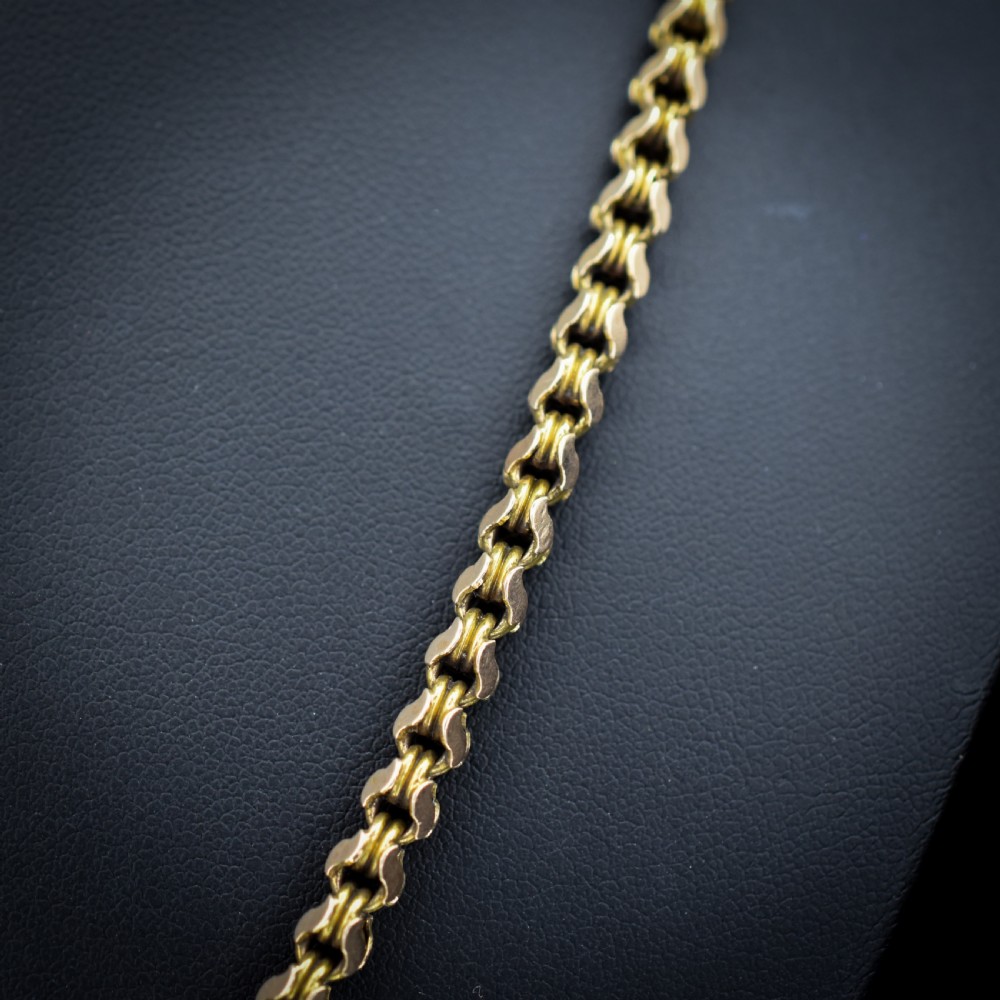 A Victorian 15ct yellow gold fancy link chain necklace fitted with a dog clip fastener. View III