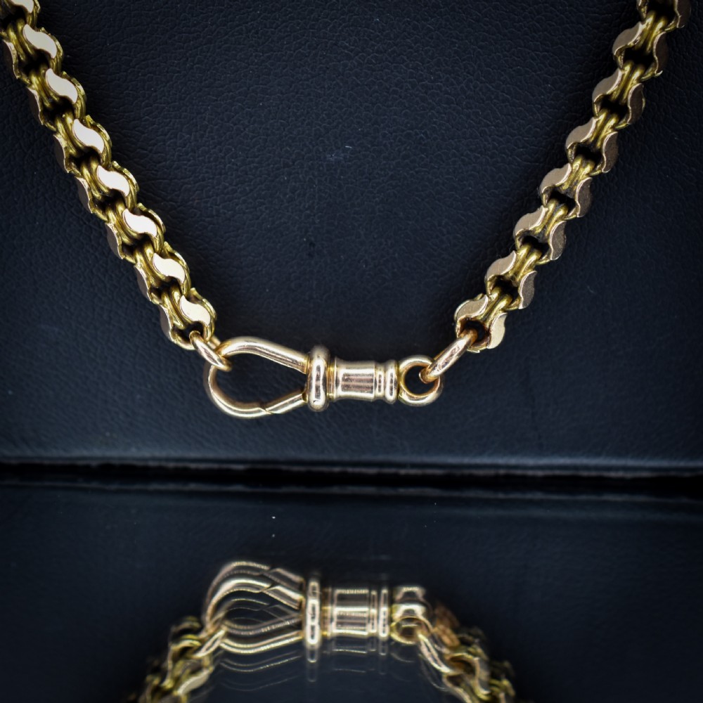 A Victorian 15ct yellow gold fancy link chain necklace fitted with a dog clip fastener. View IV