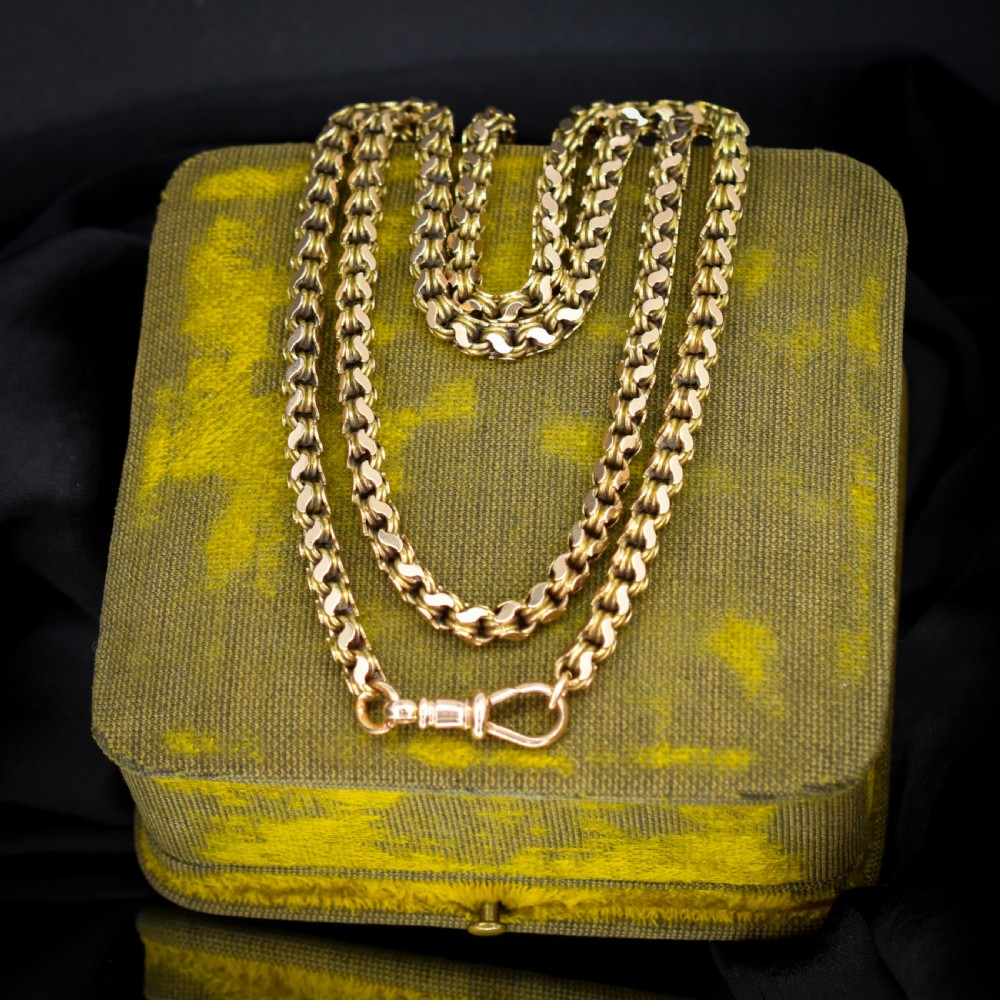 A Victorian 15ct yellow gold fancy link chain necklace fitted with a dog clip fastener. View V