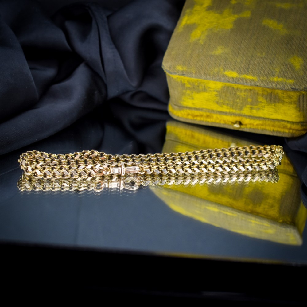 A Victorian 15ct yellow gold fancy link chain necklace fitted with a dog clip fastener. View VI