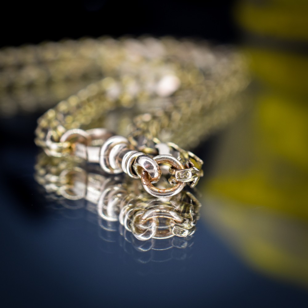 A Victorian 15ct yellow gold fancy link chain necklace fitted with a dog clip fastener. View VIII