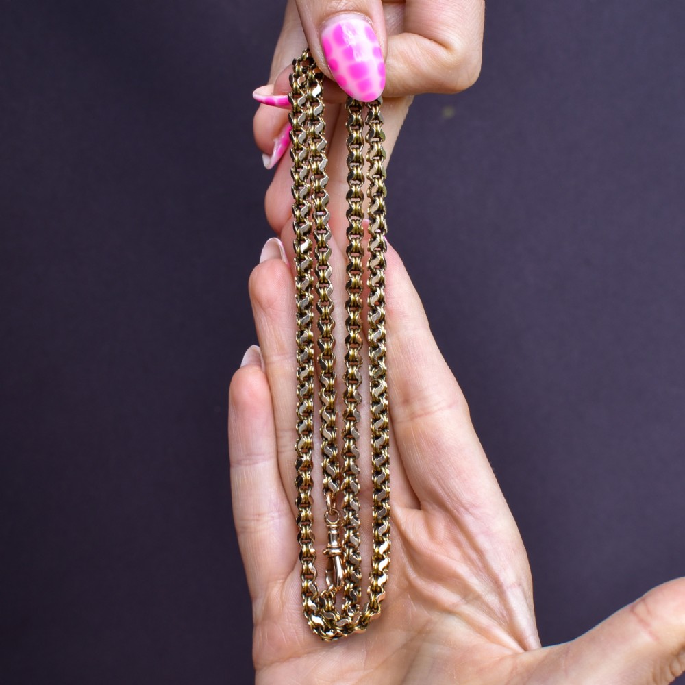 A Victorian 15ct yellow gold fancy link chain necklace fitted with a dog clip fastener. View IX