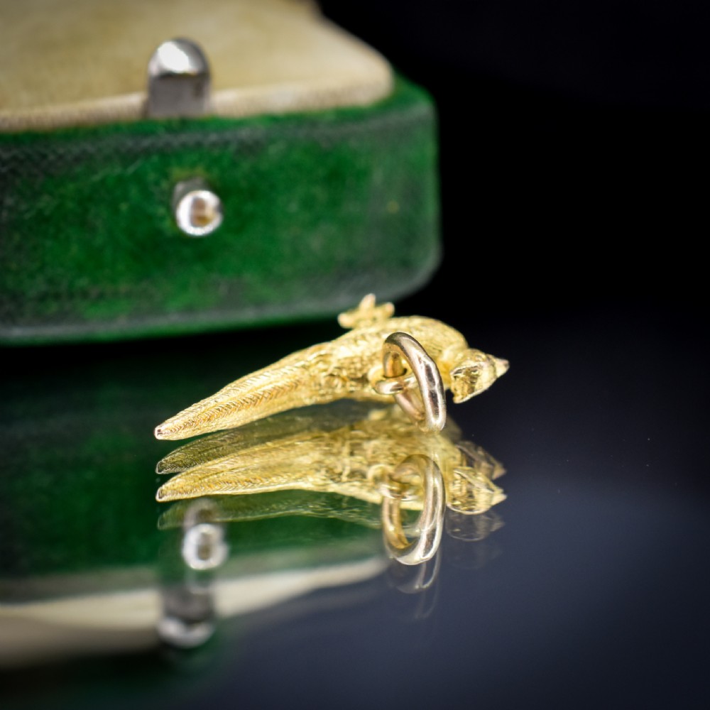 A detailed three-dimensional 9ct yellow gold pheasant bird charm with textured feathers and an attached jump ring. View III
