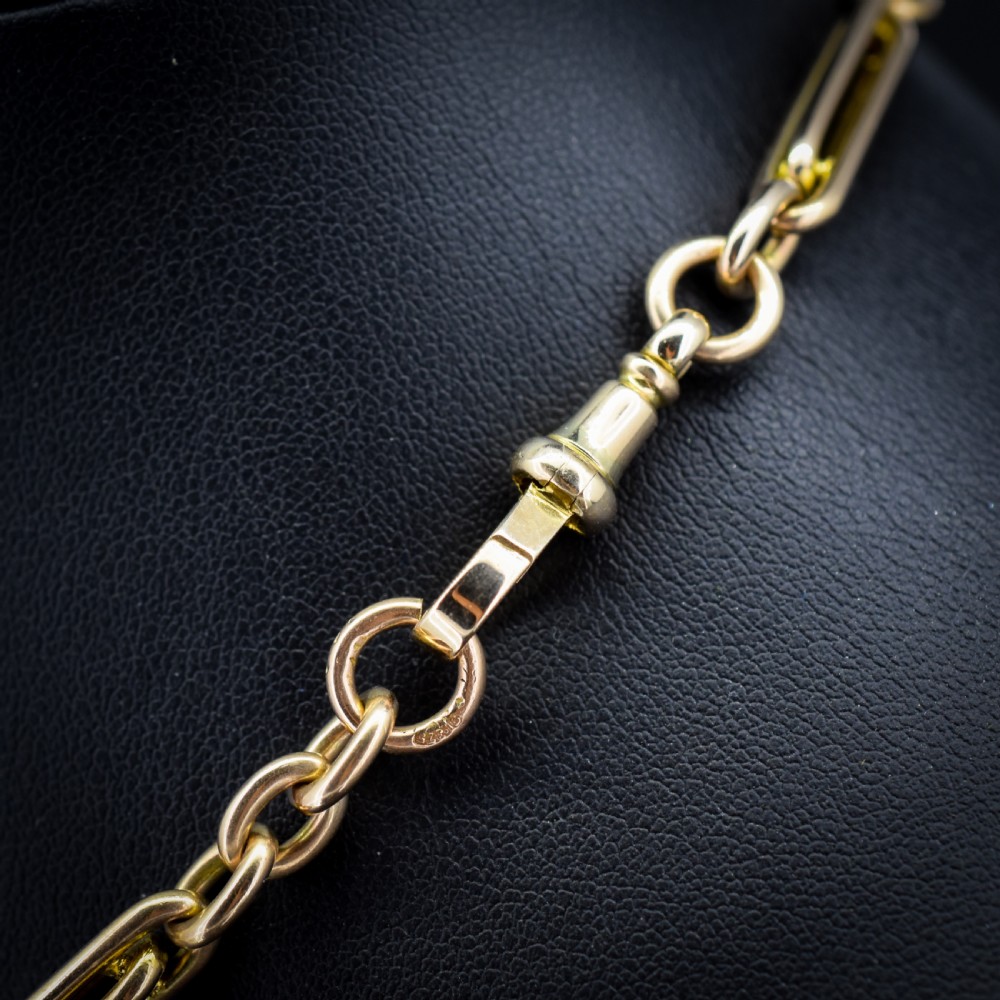 A 10ct yellow gold Albert chain with alternating trombone and oval links, complete with a T-bar and swivel clasp. View VII