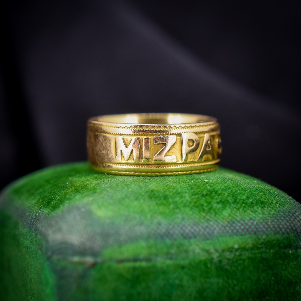 An antique 18ct yellow gold wide band ring featuring the word MIZPAH in raised relief lettering bordered by beaded detailing. View II