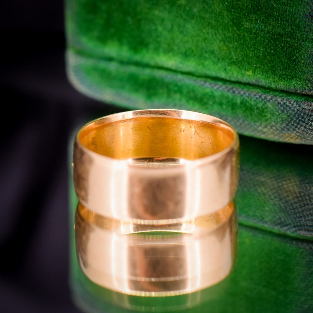 An antique 18ct yellow gold wide band ring featuring the word MIZPAH in raised relief lettering bordered by beaded detailing. View VI