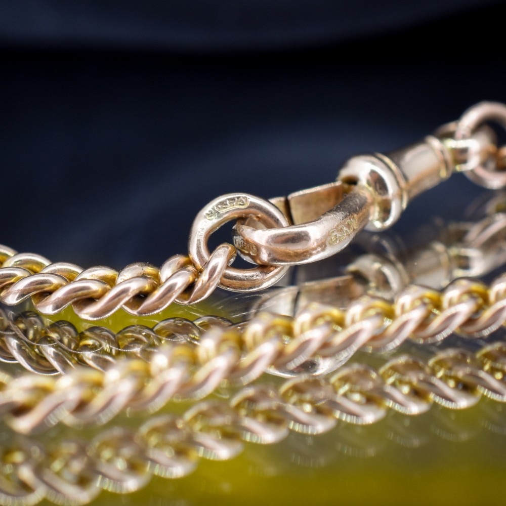 An antique 9ct yellow gold curb link chain bracelet fitted with a dog clip swivel clasp. View IV