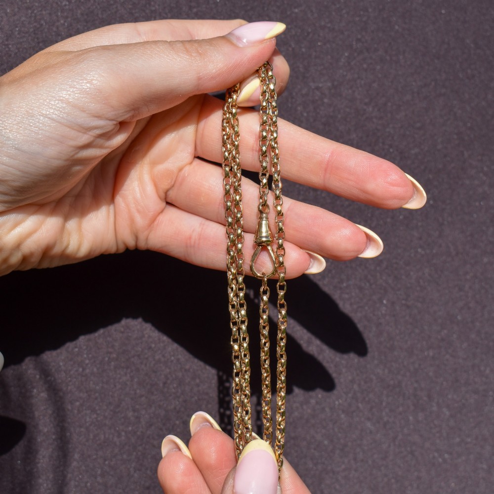 An antique Victorian 9ct yellow gold chain necklace with faceted circular links and a dog clip clasp. View VIII