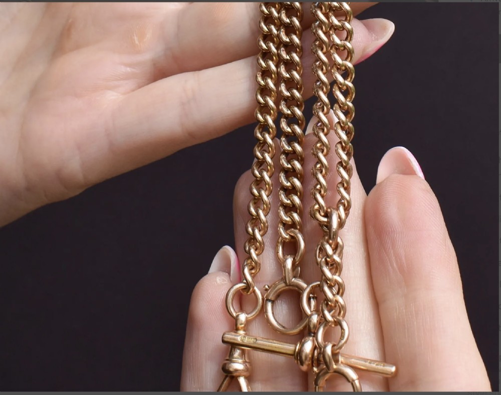 An antique 15ct yellow gold Albert chain necklace featuring curb links, a T-bar drop, a bolt ring, and a dog clip clasp. View III