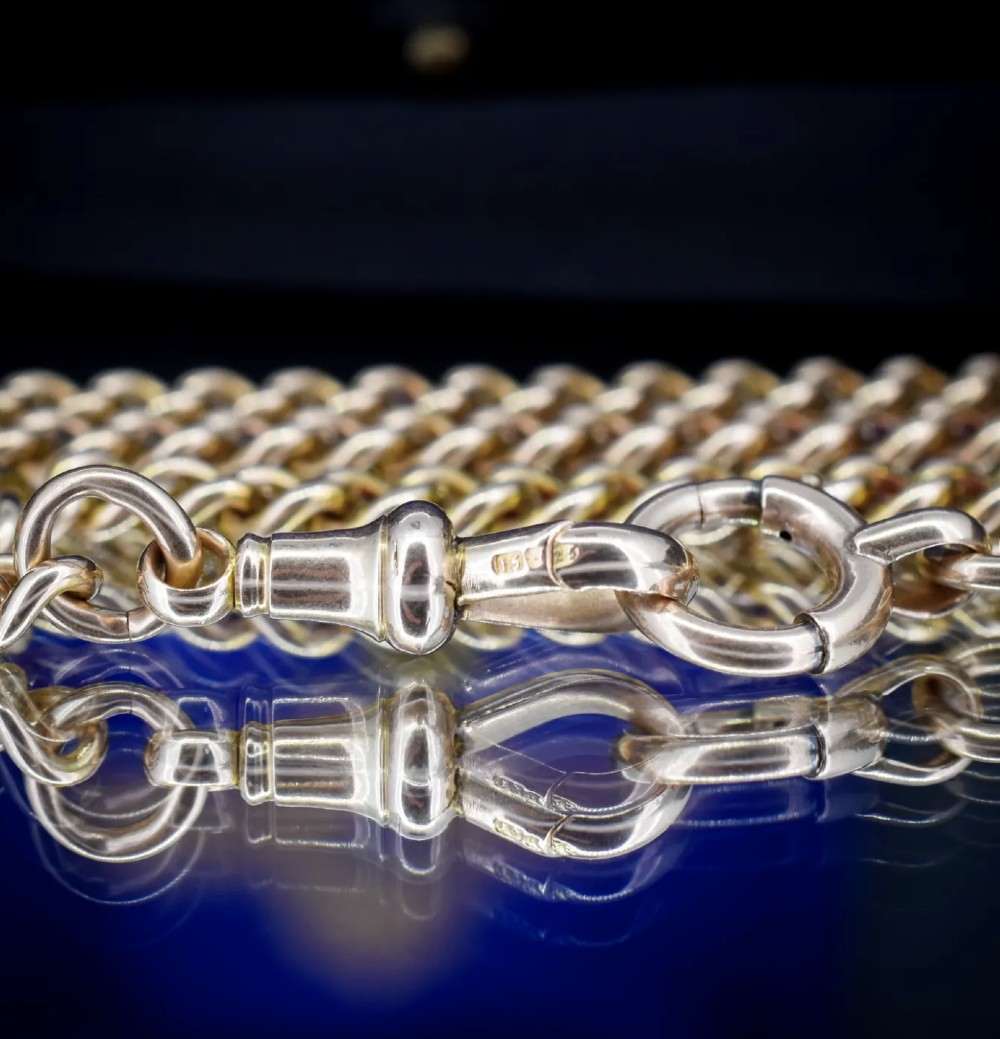 An antique 15ct yellow gold Albert chain necklace featuring curb links, a T-bar drop, a bolt ring, and a dog clip clasp. View XI