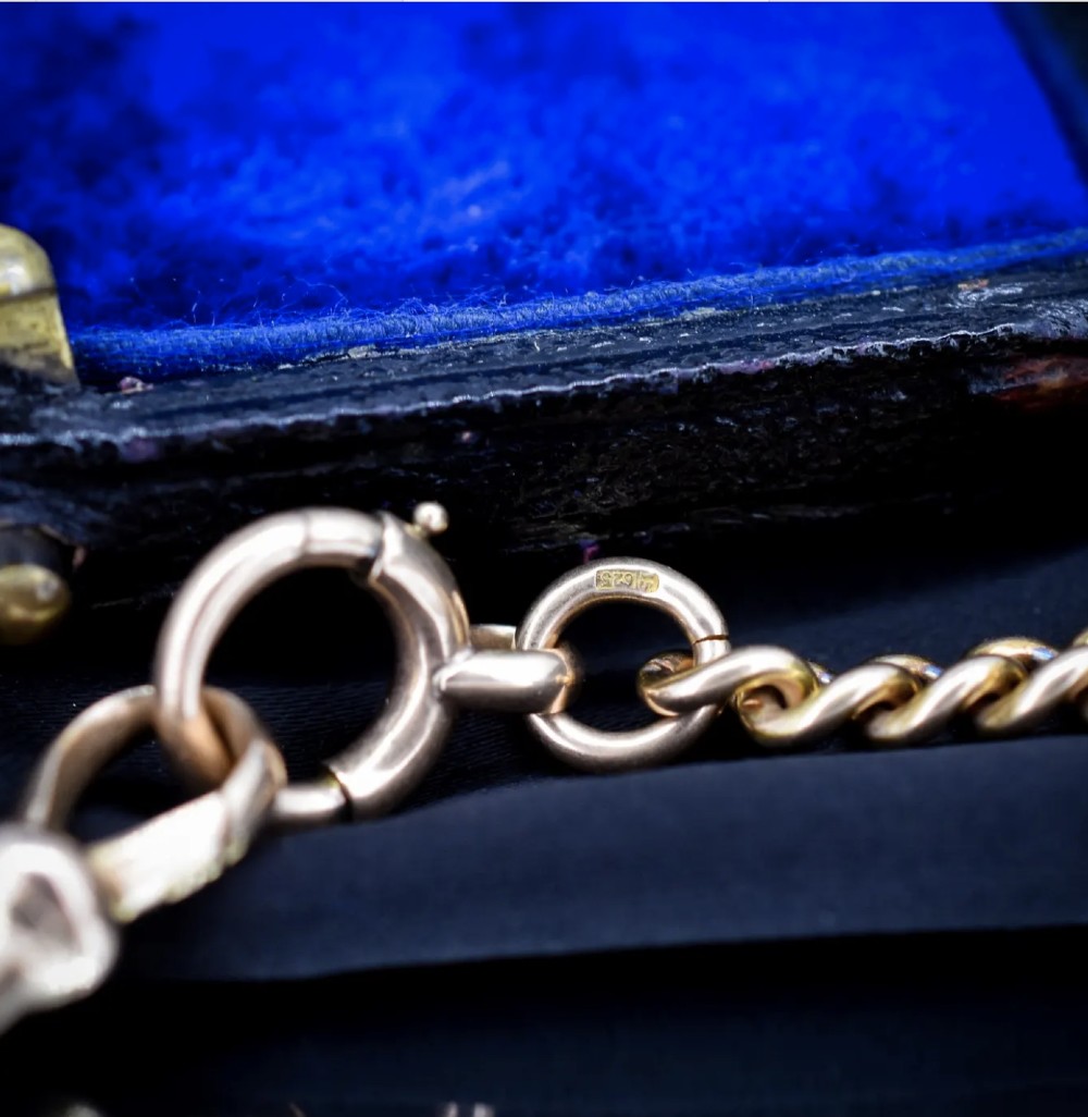 An antique 15ct yellow gold Albert chain necklace featuring curb links, a T-bar drop, a bolt ring, and a dog clip clasp. View XIII