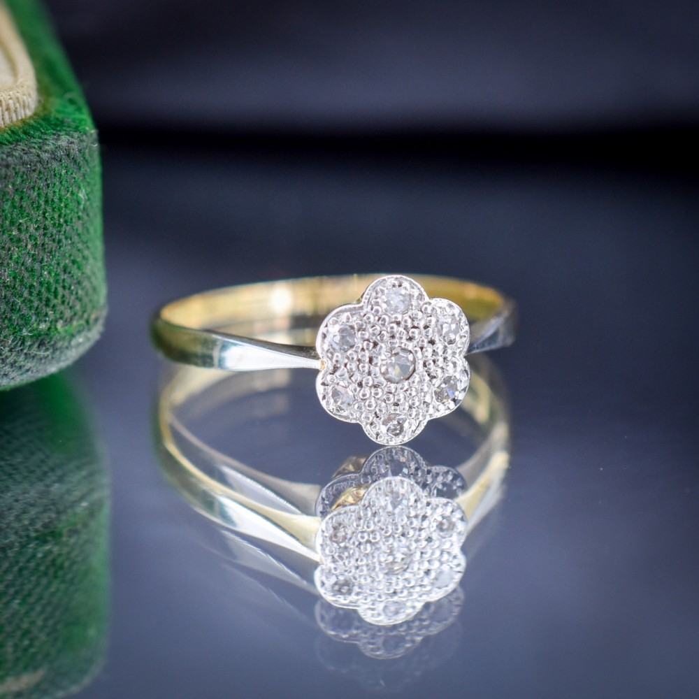 An antique 18ct yellow gold ring featuring a floral diamond cluster head set in platinum. View II