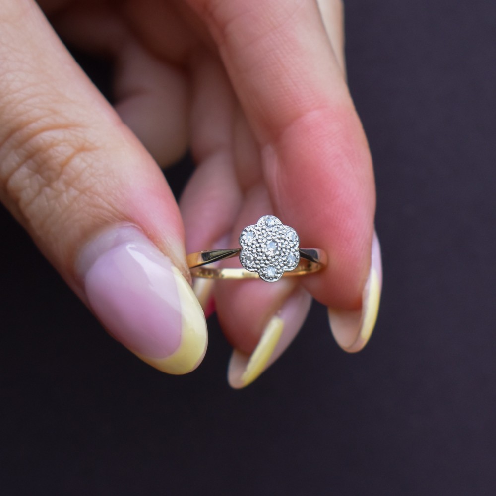 An antique 18ct yellow gold ring featuring a floral diamond cluster head set in platinum. View VIII