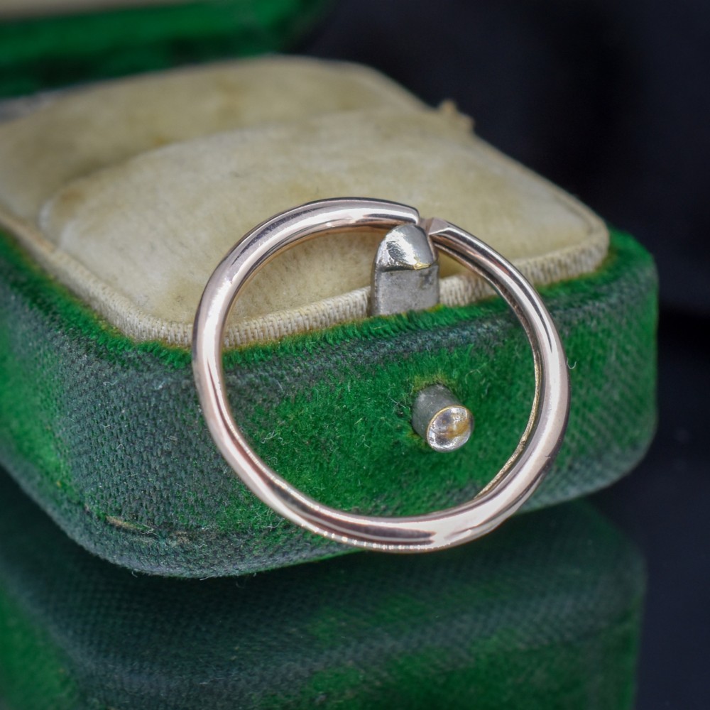 A circular 9ct gold split ring measuring 20 millimetres with a double-coiled wire design. View V
