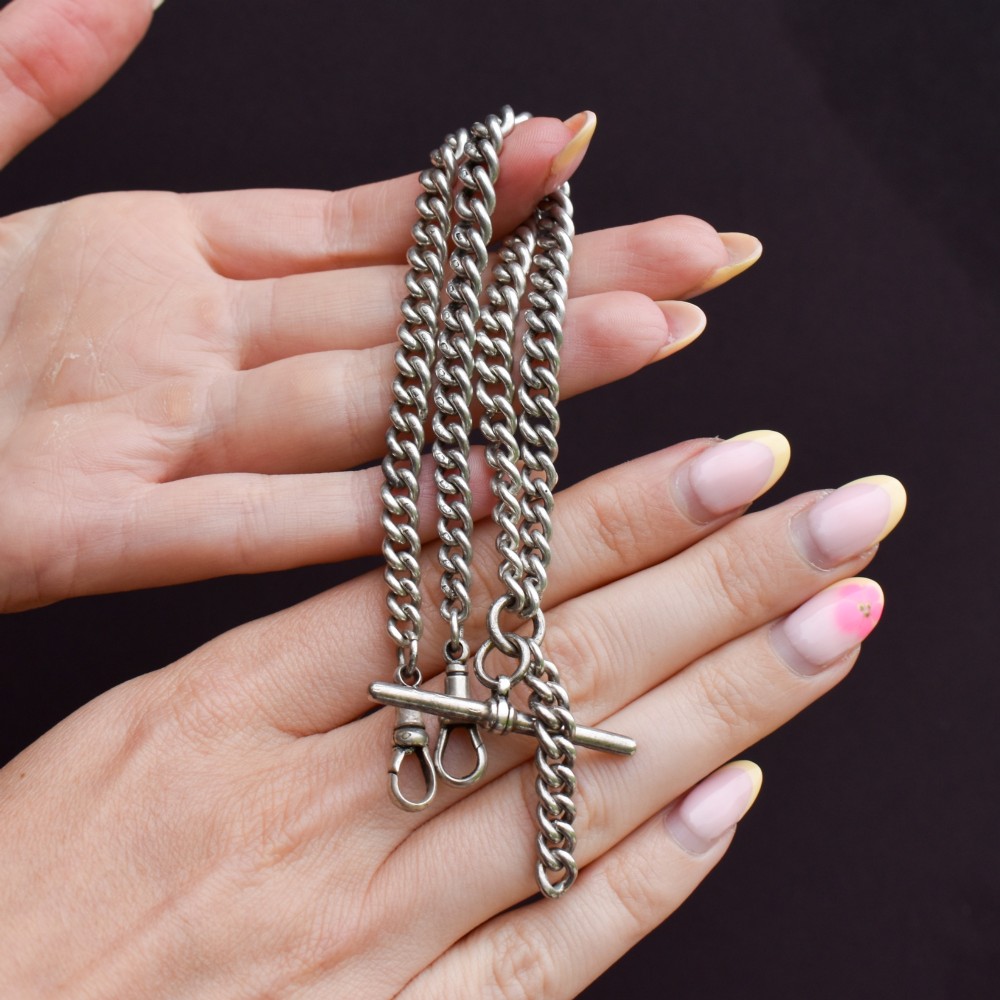A sterling silver curb link double Albert pocket watch chain featuring a central T-bar. View III