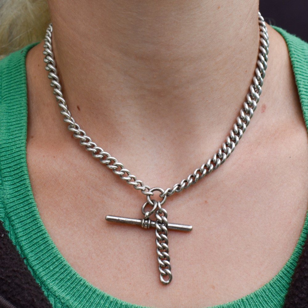 A sterling silver curb link double Albert pocket watch chain featuring a central T-bar. View IV