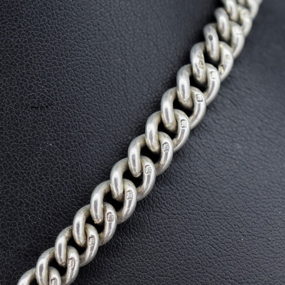 A sterling silver curb link double Albert pocket watch chain featuring a central T-bar. View VII