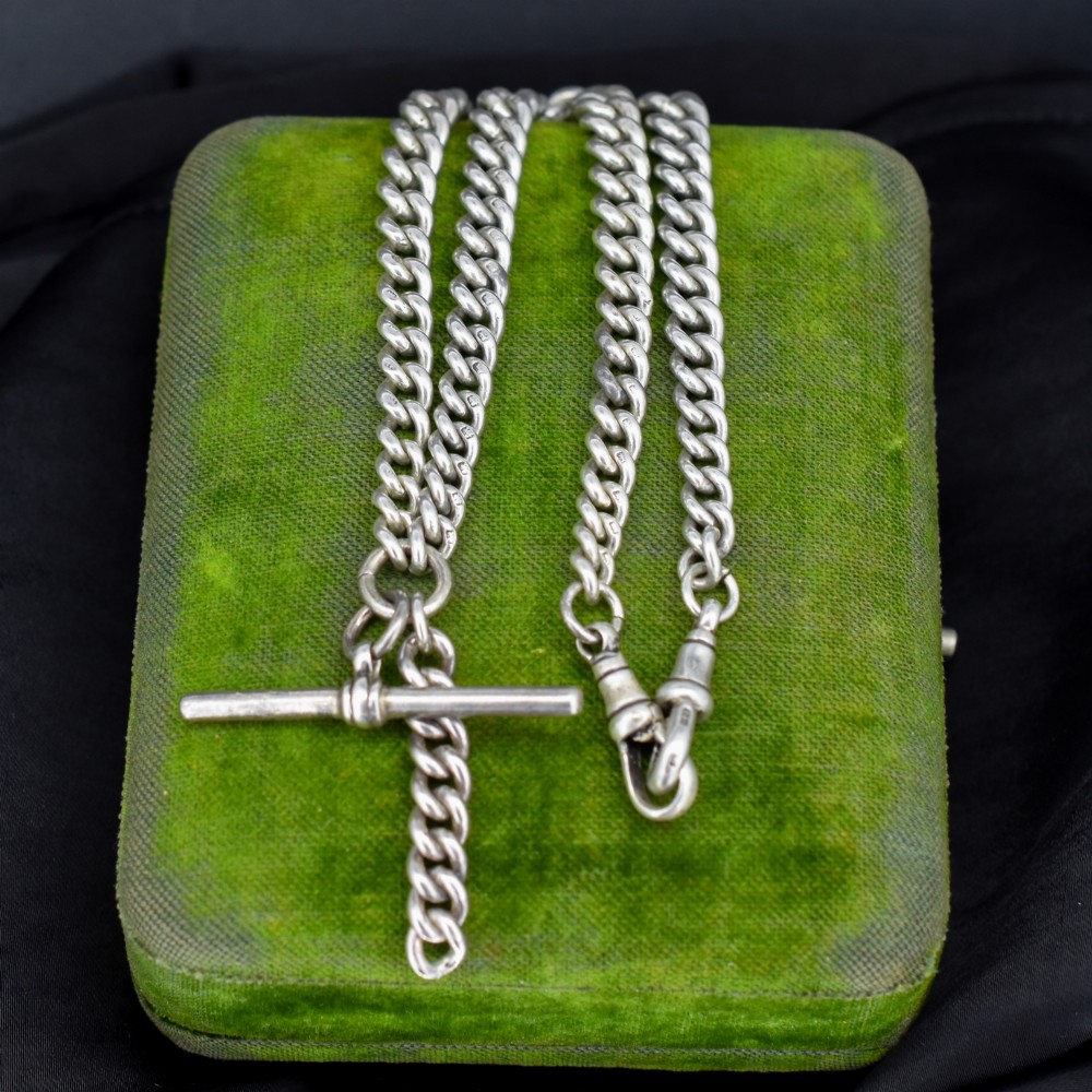 A sterling silver curb link double Albert pocket watch chain featuring a central T-bar. View IX