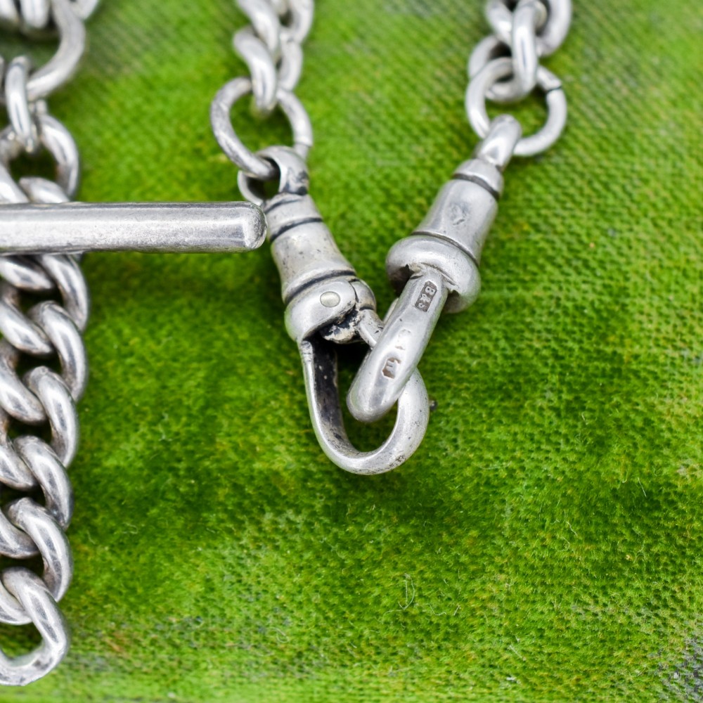 A sterling silver curb link double Albert pocket watch chain featuring a central T-bar. View X