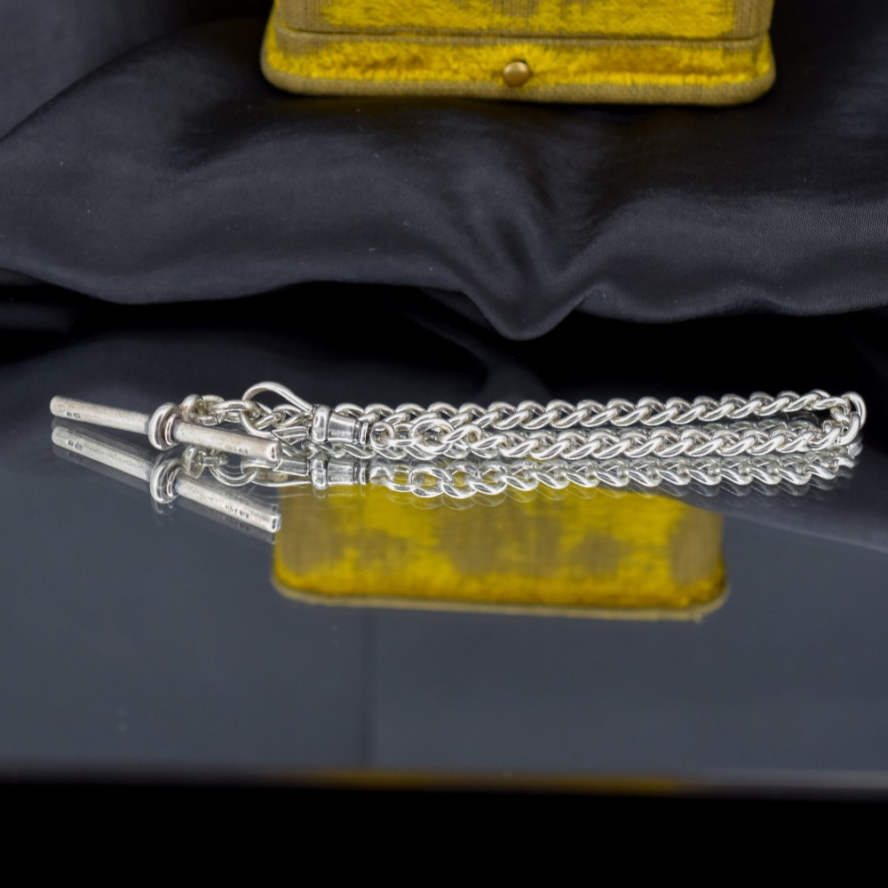 A sterling silver curb link chain bracelet featuring a swivel dog clip fastener and a T-bar pendant. View V