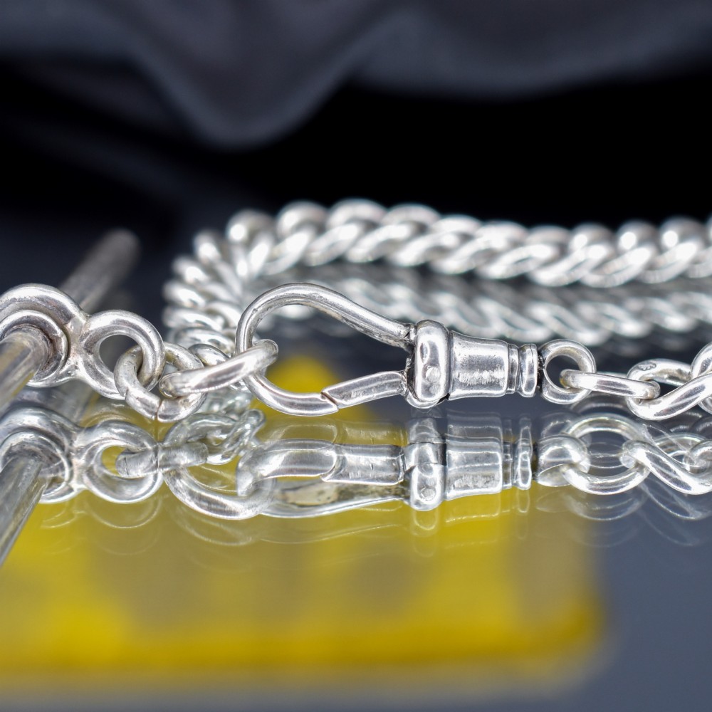 A sterling silver curb link chain bracelet featuring a swivel dog clip fastener and a T-bar pendant. View VI