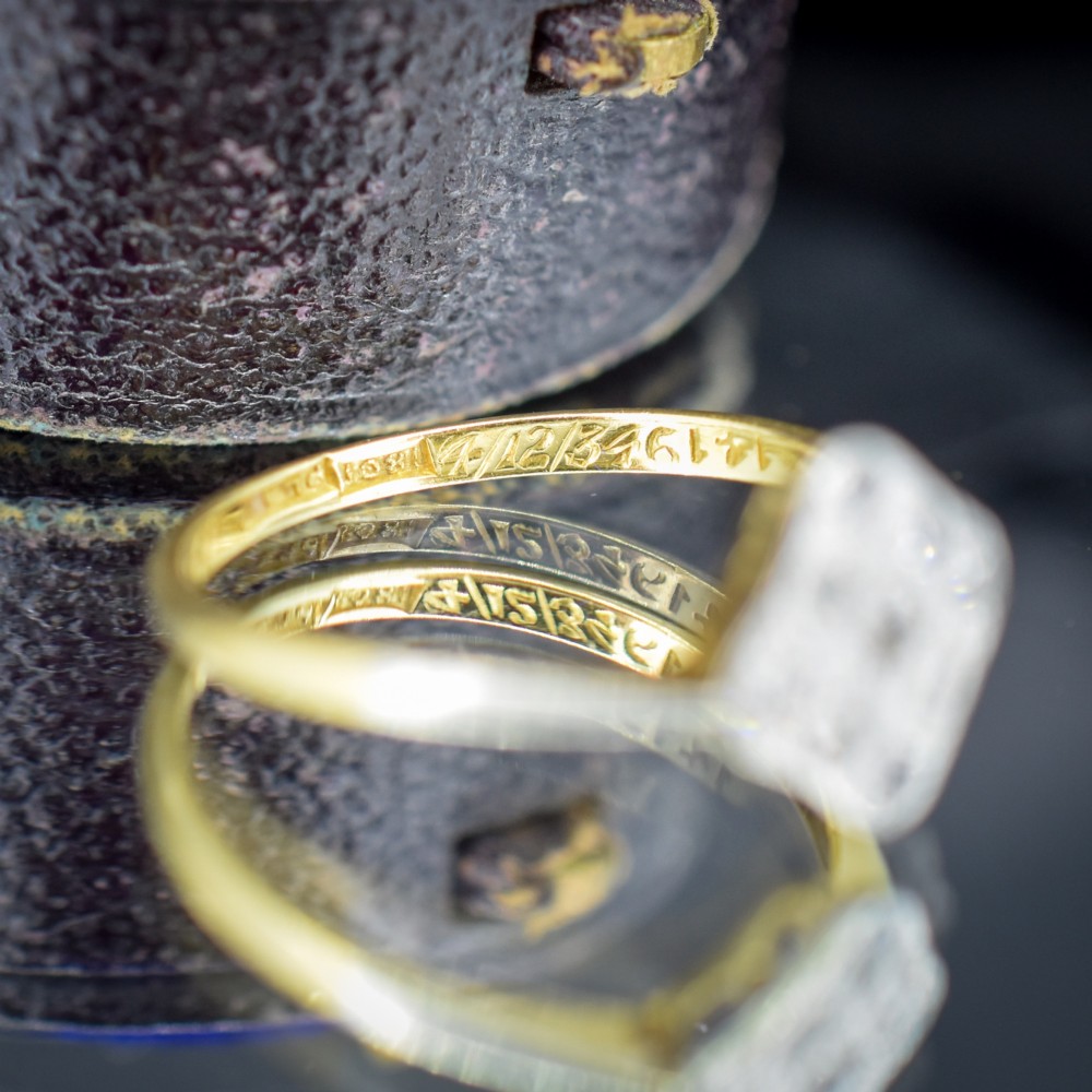 An Art Deco 18ct yellow gold ring featuring a platinum square lozenge cluster set with multiple diamonds and fine millegrain details. View VIII