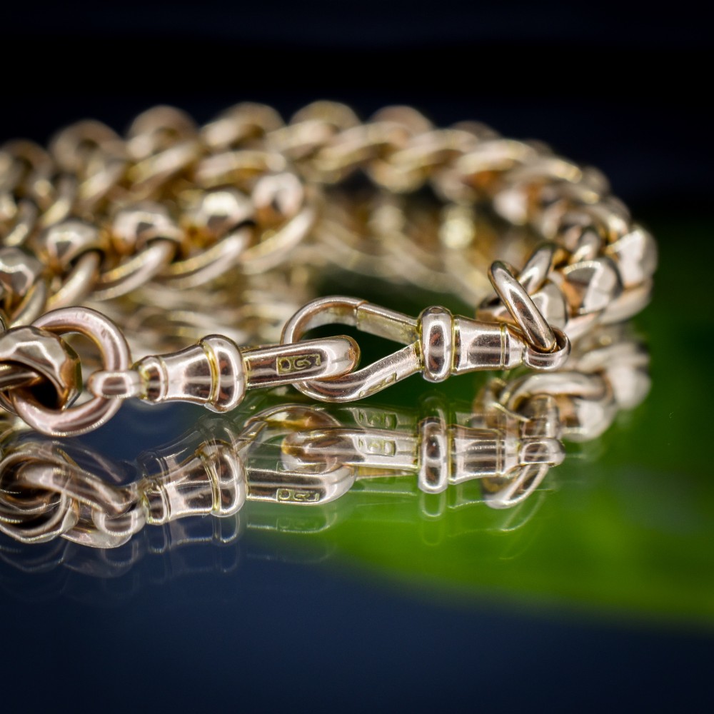 An antique 9ct yellow gold rollerball Albert chain featuring a central T-bar drop and double dog clip clasps. View VIII