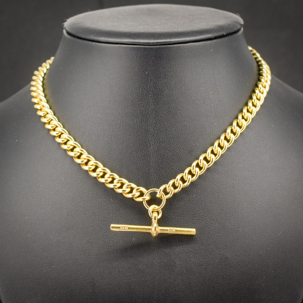 An antique gold-gilded sterling silver Albert watch chain featuring uniform curb links, a T-bar attachment, and dual swivel clasps. View II