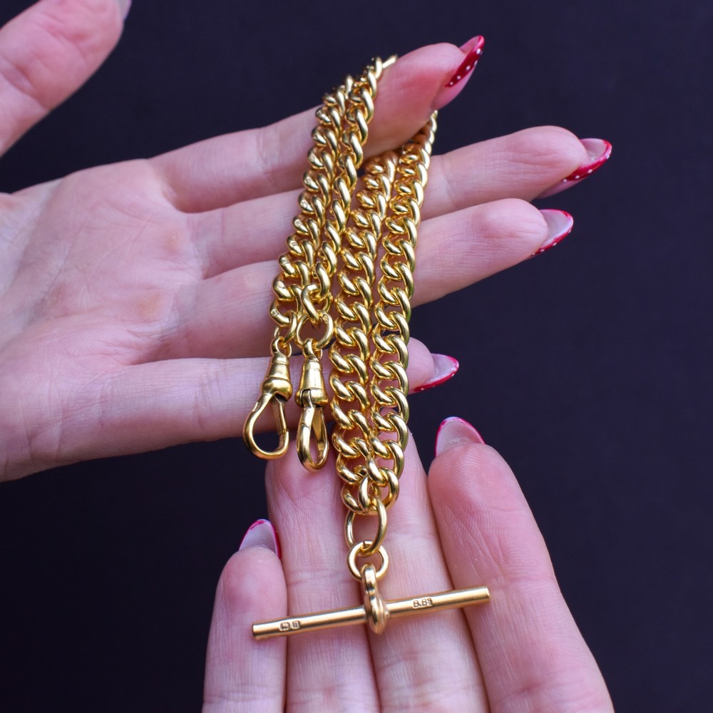 An antique gold-gilded sterling silver Albert watch chain featuring uniform curb links, a T-bar attachment, and dual swivel clasps. View X