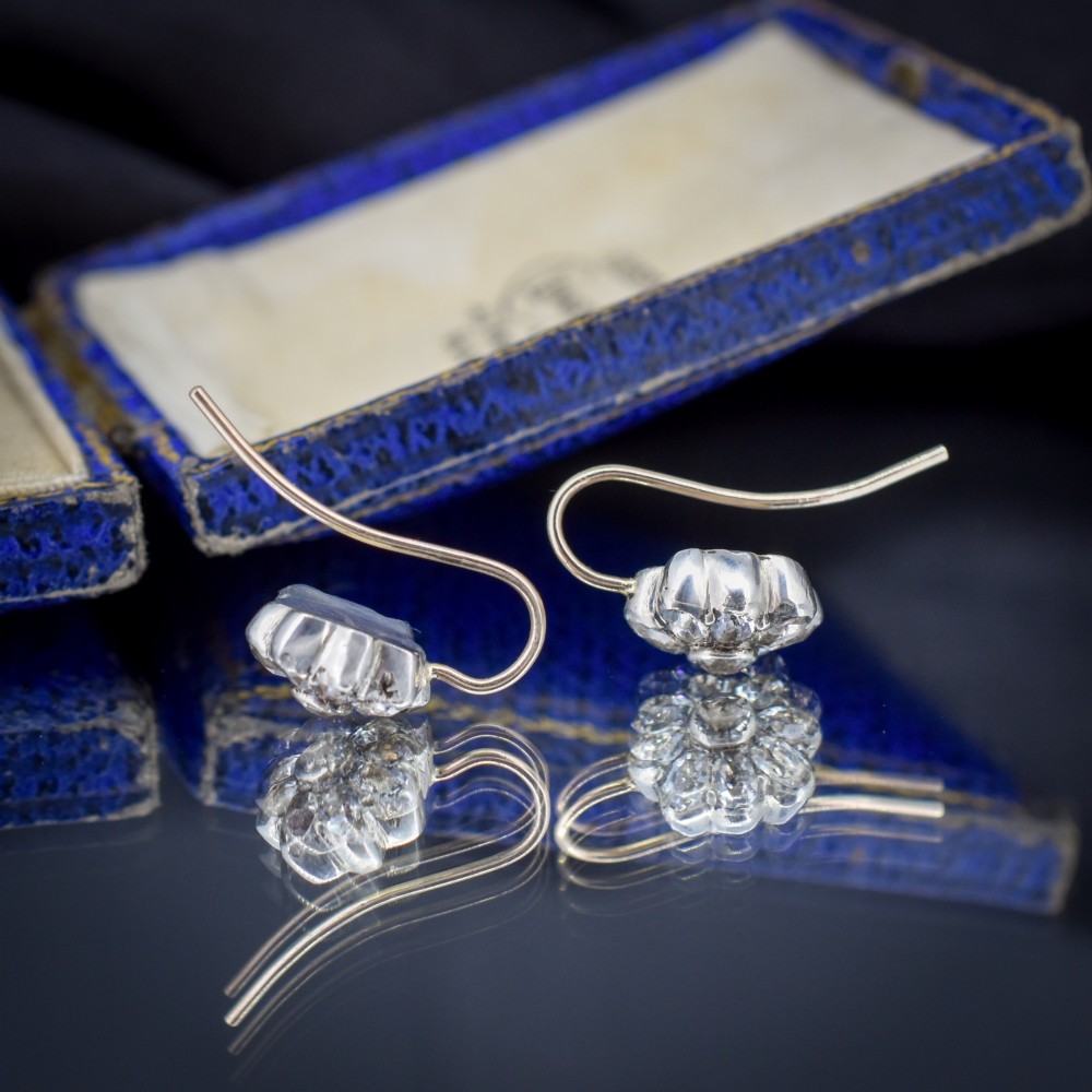 A pair of antique Georgian flower-shaped cluster earrings featuring clear paste stones set in silver with gold ear wires. View II