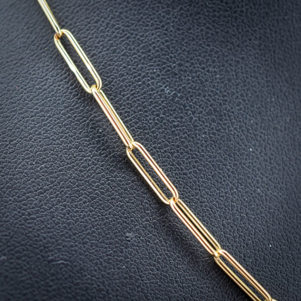 An antique 9ct yellow gold chain featuring elongated paperclip links and a swivel dog clip clasp. View V