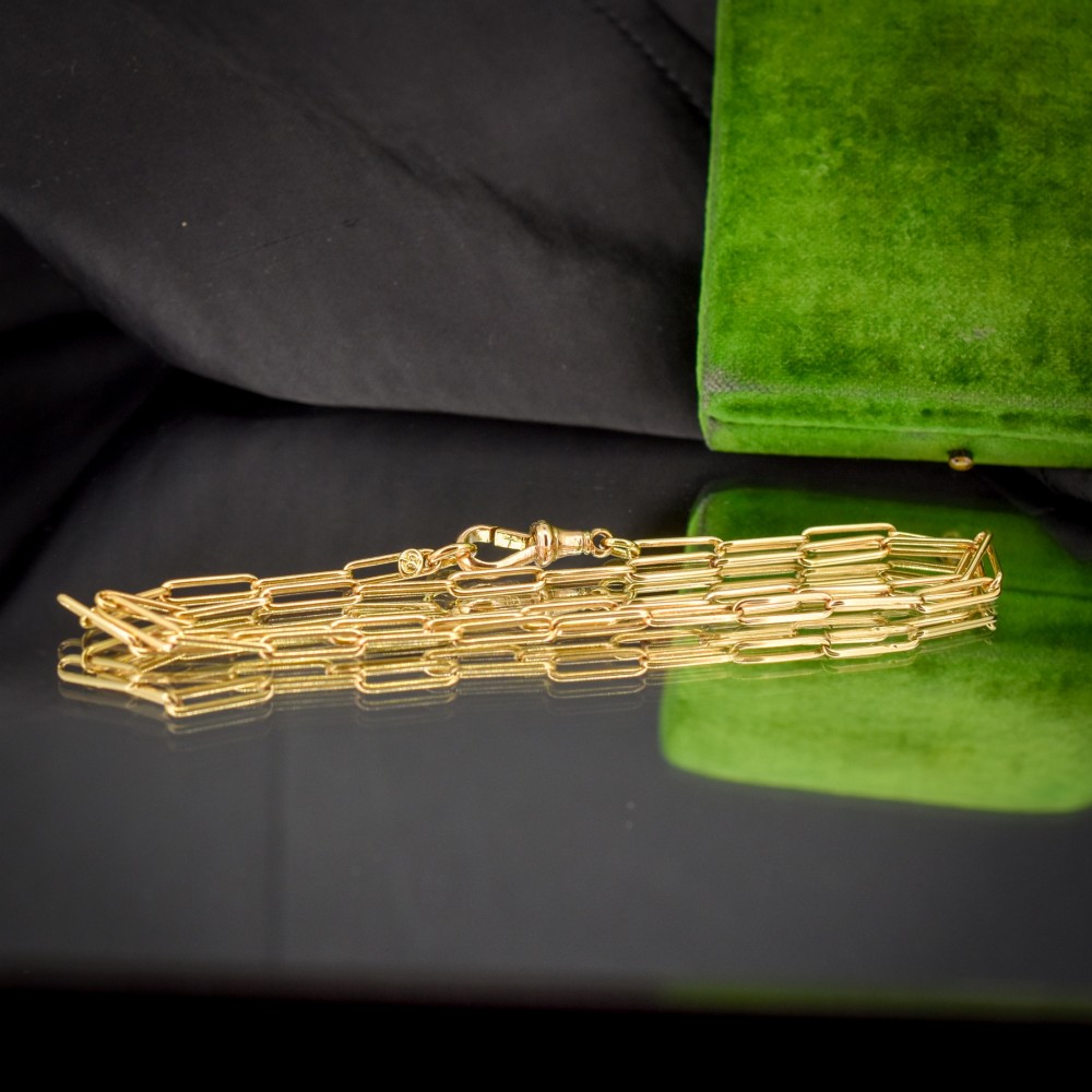 An antique 9ct yellow gold chain featuring elongated paperclip links and a swivel dog clip clasp. View VI