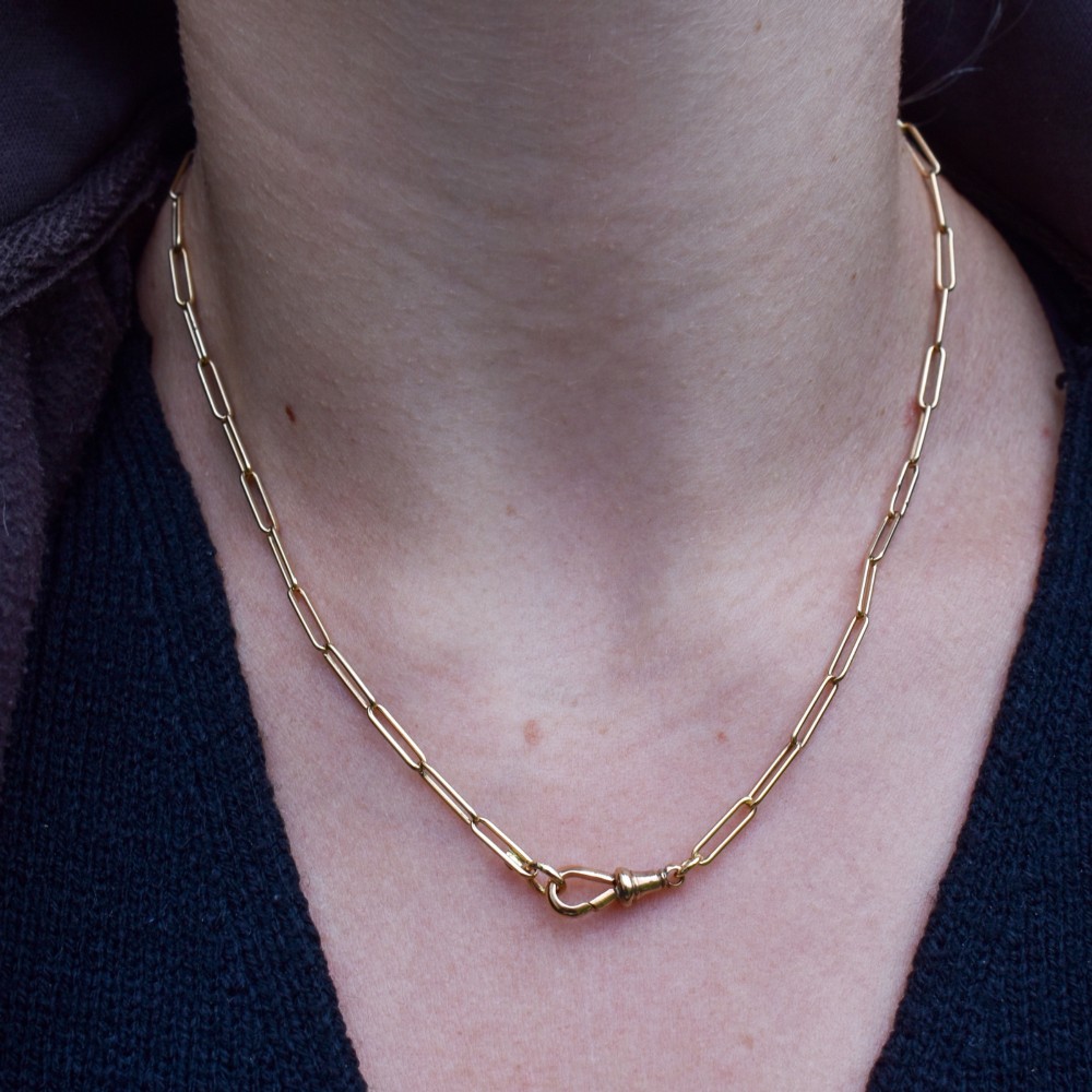 An antique 9ct yellow gold chain featuring elongated paperclip links and a swivel dog clip clasp. View VIII