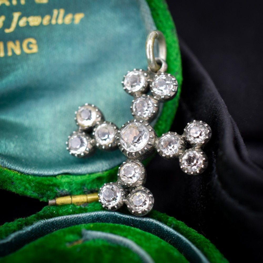 A Georgian silver bottony cross pendant set with clear faceted paste stones featuring black dot culets. View II