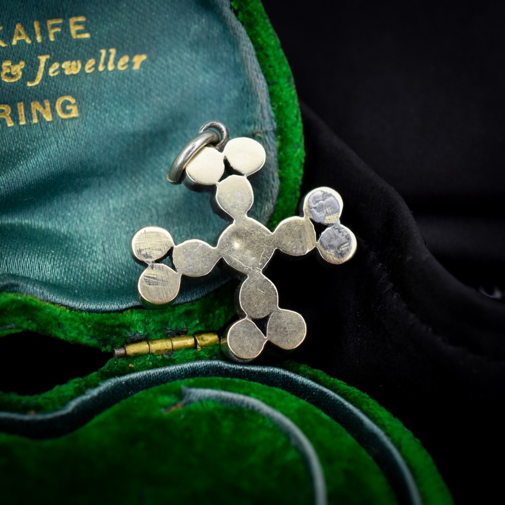 A Georgian silver bottony cross pendant set with clear faceted paste stones featuring black dot culets. View III
