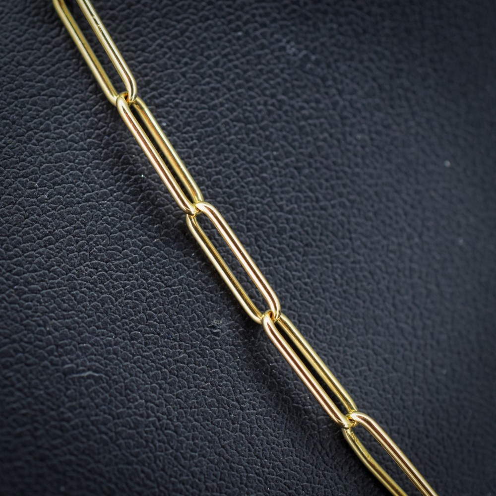 An antique 9ct yellow gold paperlink chain necklace featuring uniform elongated rectangular links and a swivel dog clip clasp. View V