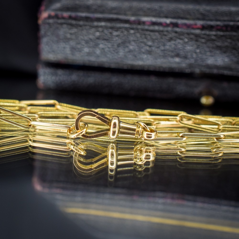 An antique 9ct yellow gold paperlink chain necklace featuring uniform elongated rectangular links and a swivel dog clip clasp. View VII