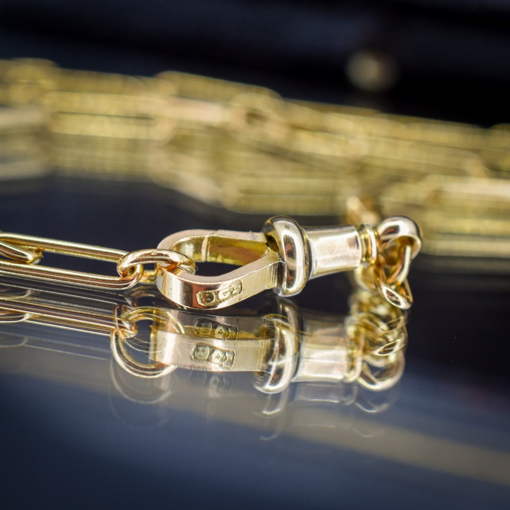 An antique 9ct yellow gold paperlink chain necklace featuring uniform elongated rectangular links and a swivel dog clip clasp. View VIII