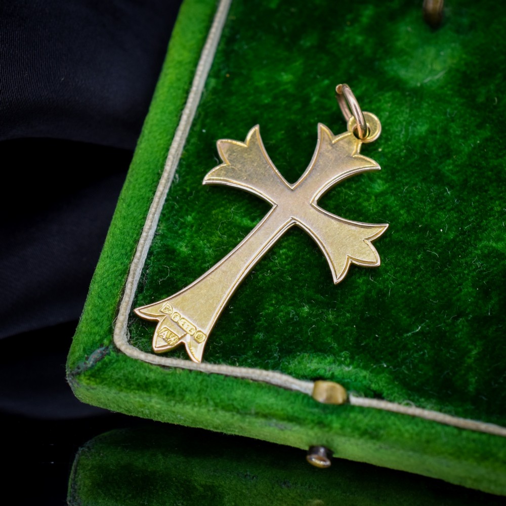 An Edwardian 9ct yellow gold cross pendant with intricate foliate hand engraving and a top suspension ring. View IV