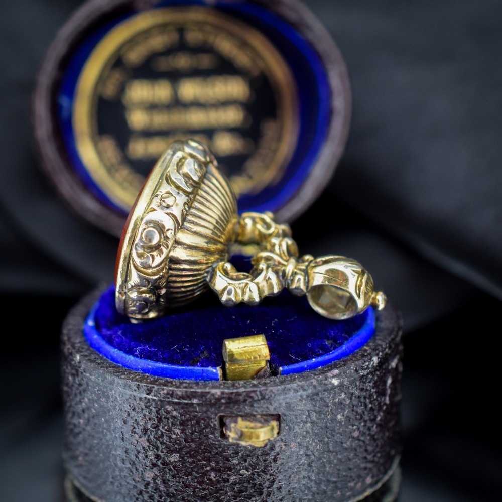 A Georgian gold fob seal set with a red carnelian intaglio engraved with a sailing ship and the French inscription Telle Est La Vie. View III