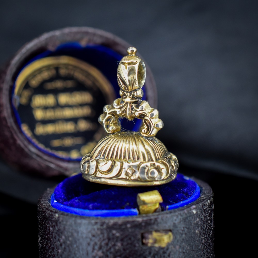 A Georgian gold fob seal set with a red carnelian intaglio engraved with a sailing ship and the French inscription Telle Est La Vie. View IV